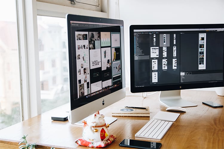 desk with dual monitor desktop pc