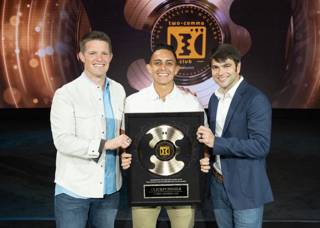 Jonathan Montoya receives 2 Comma Club Award by Russell Brunson and Todd Dickerson of ClickFunnels