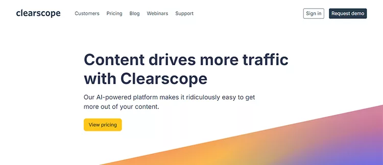 Screenshot of Clearscope's homepage displaying text: "Content drives more traffic with Clearscope. Our AI-powered platform makes it ridiculously easy to get more out of your content." Buttons for "Sign in" and "Request demo" are present.