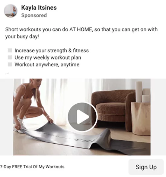 A woman unrolls an exercise mat in a living room setting. The image includes text promoting short, at-home workouts with a 7-day free trial offer and a "Sign Up" button.